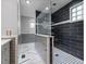 Contemporary bathroom showcasing a glass-enclosed shower with sleek black and white tile at 119 Valleycastle Ct, Clayton, NC 27520