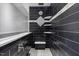 Modern bathroom featuring a sleek black tiled shower with a built-in bench and stylish fixtures at 119 Valleycastle Ct, Clayton, NC 27520