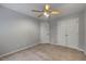Neutral bedroom with ceiling fan and double door closet for ample storage at 119 Valleycastle Ct, Clayton, NC 27520