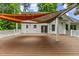 Covered deck with railings offers a relaxing outdoor space for gatherings at 119 Valleycastle Ct, Clayton, NC 27520