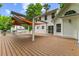 Expansive deck features shade canopy, with plenty of room for lounging and dining at 119 Valleycastle Ct, Clayton, NC 27520