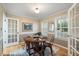 Cozy dining room featuring a hardwood floor, table with four chairs and natural light at 119 Valleycastle Ct, Clayton, NC 27520