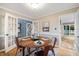 Cozy dining room featuring a hardwood floor, table with four chairs and natural light at 119 Valleycastle Ct, Clayton, NC 27520