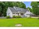 Attractive white home with red shutters, lush green lawn, and well-maintained landscaping at 119 Valleycastle Ct, Clayton, NC 27520