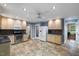 Modern kitchen with stainless steel appliances, granite countertops, and light colored cabinets at 119 Valleycastle Ct, Clayton, NC 27520