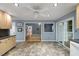 Open kitchen with light cabinets, view to the living room, and sliding glass doors to the outdoor patio area at 119 Valleycastle Ct, Clayton, NC 27520