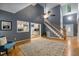 Spacious living room with hardwood floors, a decorative rug, and an open view to the updated kitchen at 119 Valleycastle Ct, Clayton, NC 27520