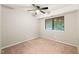 Bedroom featuring a ceiling fan, plush carpet and a large window at 1200 Schaub Dr # G, Raleigh, NC 27606