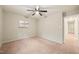 Spacious carpeted bedroom with ceiling fan and neutral colored walls at 1200 Schaub Dr # G, Raleigh, NC 27606