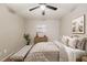 Cozy bedroom with a neutral palette features ceiling fan and lots of natural light at 1200 Schaub Dr # G, Raleigh, NC 27606