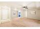 Bright living room with neutral walls, carpeted floors, and kitchen view at 1200 Schaub Dr # G, Raleigh, NC 27606