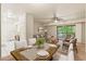 Open floorplan dining and living area with large windows and sliding glass doors to the outside deck at 1200 Schaub Dr # G, Raleigh, NC 27606