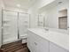 Modern bathroom with glass-enclosed shower, sleek vanity, and neutral walls at 1205 Solace Way, Rolesville, NC 27571