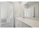 Bathroom featuring a large mirror, white vanity with countertop space, and modern fixtures at 1205 Solace Way, Rolesville, NC 27571