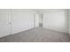 Bright bedroom featuring neutral walls and soft gray carpeting providing a calm and relaxing space at 1205 Solace Way, Rolesville, NC 27571