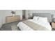 Neutral bedroom features a comfortable bed, elegant furnishings, and ample closet space at 1205 Solace Way, Rolesville, NC 27571