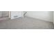 Spacious living room featuring plush gray carpet and abundant natural light at 1205 Solace Way, Rolesville, NC 27571