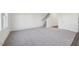 Open living space featuring gray carpet, complemented by neutral walls and natural light at 1205 Solace Way, Rolesville, NC 27571