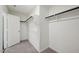 Bright walk-in closet features carpeted floors and ample shelving with a clothing rod at 1205 Solace Way, Rolesville, NC 27571