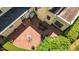 Aerial view of the brick patio, showcasing its ample seating and lush landscaping surrounding the home at 1217 Aycock Ave, Burlington, NC 27215