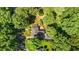 Estate aerial view showcases mature trees surrounding the house, offering privacy and natural beauty at 1217 Aycock Ave, Burlington, NC 27215