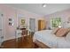 Comfortable bedroom with a desk and a vintage armoire at 1217 Aycock Ave, Burlington, NC 27215