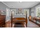 Cozy bedroom with hardwood floors and a view of the outside at 1217 Aycock Ave, Burlington, NC 27215