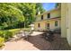 Expansive brick patio featuring metal table and chairs, ideal for outdoor dining and relaxation at 1217 Aycock Ave, Burlington, NC 27215