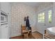 Charming entryway featuring vintage wallpaper, wooden bench, and access to the outdoors at 1217 Aycock Ave, Burlington, NC 27215