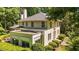 Exterior elevation of the house featuring well-manicured landscaping and multiple windows allowing natural light at 1217 Aycock Ave, Burlington, NC 27215