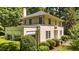 Beautiful exterior of the home surrounded by green landscaping, showcasing the architectural charm and curb appeal at 1217 Aycock Ave, Burlington, NC 27215