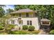Spacious home surrounded by lush greenery and has a charming entrance at 1217 Aycock Ave, Burlington, NC 27215