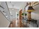 Welcoming foyer featuring hardwood floors, staircase, and stylish console table with decorative accents at 1217 Aycock Ave, Burlington, NC 27215
