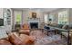 Inviting living room with a fireplace, plush seating, and a colorful area rug at 1217 Aycock Ave, Burlington, NC 27215
