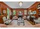 Inviting living room features wood-paneled walls, a fireplace, and sophisticated seating arrangements at 1217 Aycock Ave, Burlington, NC 27215