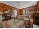 Spacious living room featuring wood paneling, a decorative rug, and elegant furnishings at 1217 Aycock Ave, Burlington, NC 27215