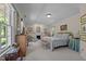 Serene main bedroom with a fireplace, large windows, and soft neutral tones at 1217 Aycock Ave, Burlington, NC 27215