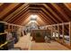 Spacious attic features exposed wood beams, offering ample storage or potential conversion space at 1229 Perry Bluff Dr, Wake Forest, NC 27587
