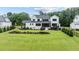 Expansive backyard featuring lush greenery, manicured landscaping, and a private fenced perimeter at 1229 Perry Bluff Dr, Wake Forest, NC 27587