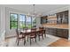 Sunlit dining room with dark wood accents and views of the backyard at 1229 Perry Bluff Dr, Wake Forest, NC 27587