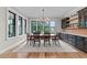 Formal dining room with modern lighting, large windows, and stylish cabinetry at 1229 Perry Bluff Dr, Wake Forest, NC 27587