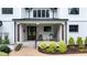 Charming front porch with stone steps, and a seating area at 1229 Perry Bluff Dr, Wake Forest, NC 27587