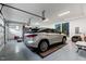 Modern garage with epoxy flooring, featuring ample space for parking and extra storage at 1229 Perry Bluff Dr, Wake Forest, NC 27587