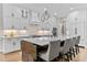 Bright kitchen with white cabinets, tile backsplash, and a large island with seating at 1229 Perry Bluff Dr, Wake Forest, NC 27587