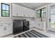 Well-equipped laundry room featuring modern washer, dryer, and ample cabinet space at 1229 Perry Bluff Dr, Wake Forest, NC 27587