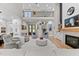 Elegant living room featuring fireplace, tall ceilings, and an open floor plan at 1229 Perry Bluff Dr, Wake Forest, NC 27587