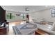 Spacious living room with hardwood floors, recessed lighting, large windows and a ceiling fan at 1229 Perry Bluff Dr, Wake Forest, NC 27587