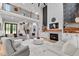 Bright living room with fireplace, a second story overlook, and hardwood floors at 1229 Perry Bluff Dr, Wake Forest, NC 27587