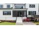 Screened-in porch with stairs to backyard, deck, and manicured landscaping at 1229 Perry Bluff Dr, Wake Forest, NC 27587
