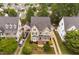 Charming home with lush front yard landscaping, a porch, and a two-car driveway at 128 Low Country Ct, Morrisville, NC 27560